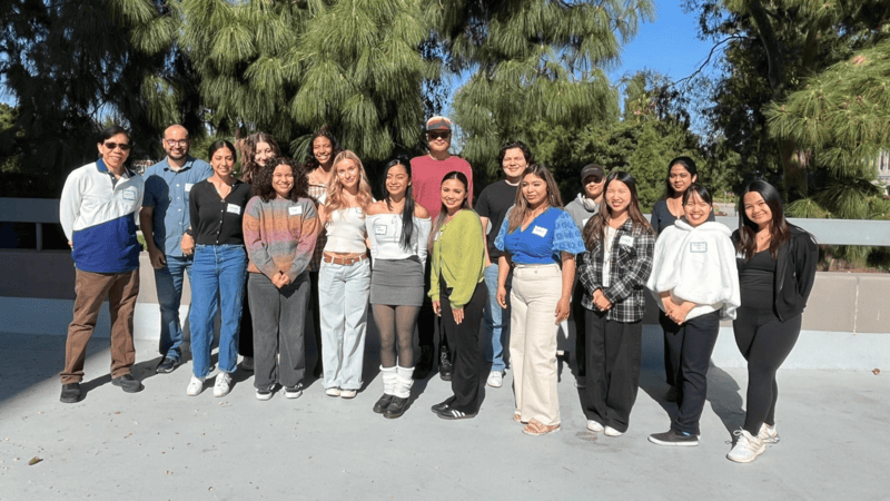 Group of students and faculty smiling